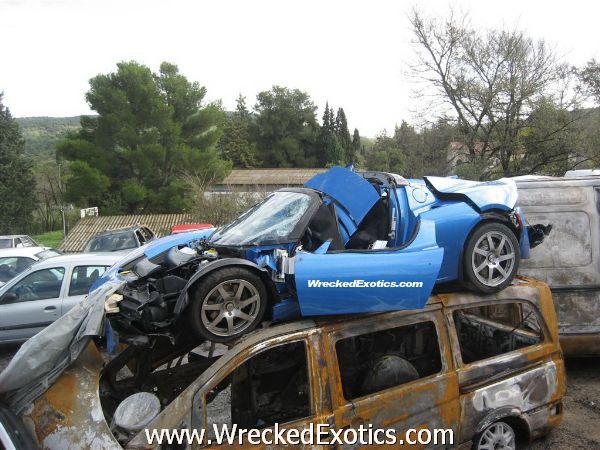 Tesla Roadster Suffers Devastating 100 MPH Crash | WreckedExotics.com