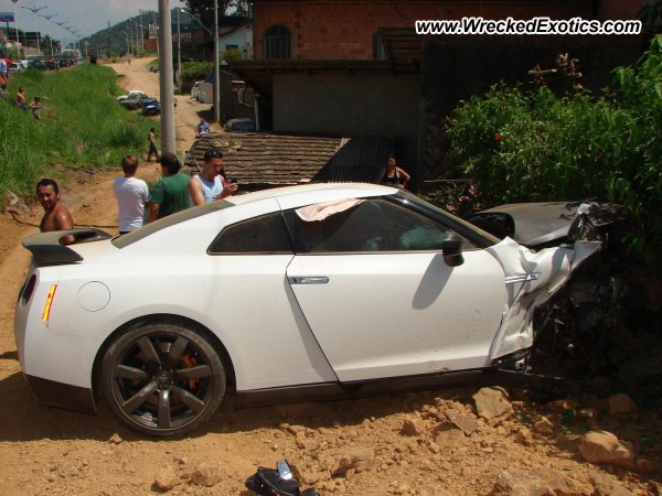 The Nissan GTR slammed into the back of another car then ran off the road