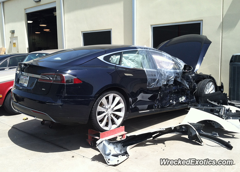 brand new tesla model s at a repair shop in dallas the crumple zone looks like